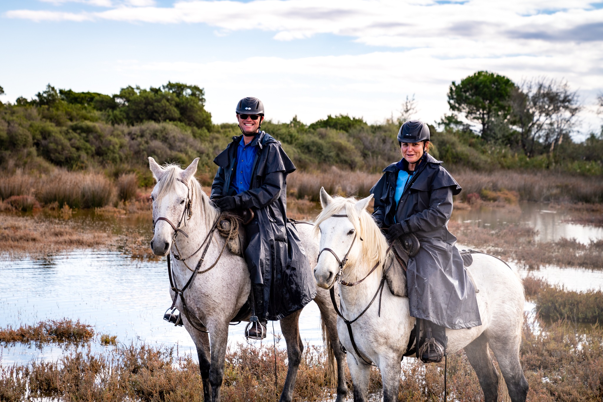 riders wearing rainproof jacket Globetrotting horse riding holidays
