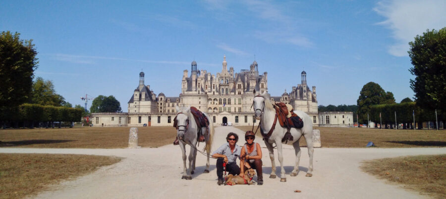 horses and riding in front of french castle horse riding holiday by globetrotting