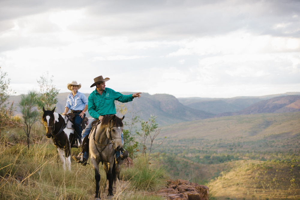 guides on horseback on mountain overlooking canyon valley on horse riding holiday the Kimberleys by Globetrotting